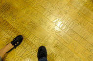 A maple floor with the first lines of many pieces of literature in eleven languages Seattle-2127.jpg