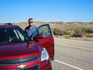 Doug and the rented Chevy Equinox that we drove on our road trip in the Southwest. DSCN2916.jpg