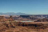 A view east from near the Dead Horse Point Visitor Center. The blue in the middle foreground is part of a potash mining operation. The La Sal Mountains in the background are in Utah, just west of the border with Colorado. _DSC2113.jpg