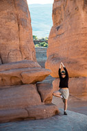 Sue in a yoga pose at Delicate Arch _DSC2363-Edit-2.jpg